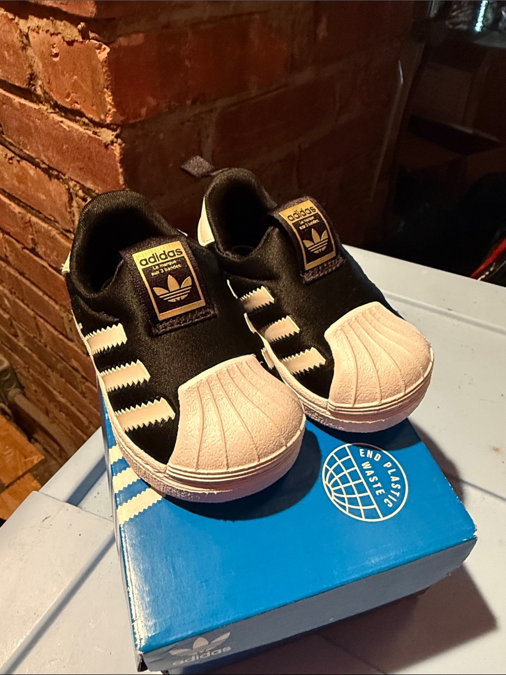 adidas Kids Black and White Slip-On Shell Toe Sneakers 4